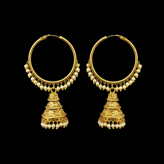 Gold hoop earrings with pearl drops on a gray stand, featuring the brand 'SAHELI'.