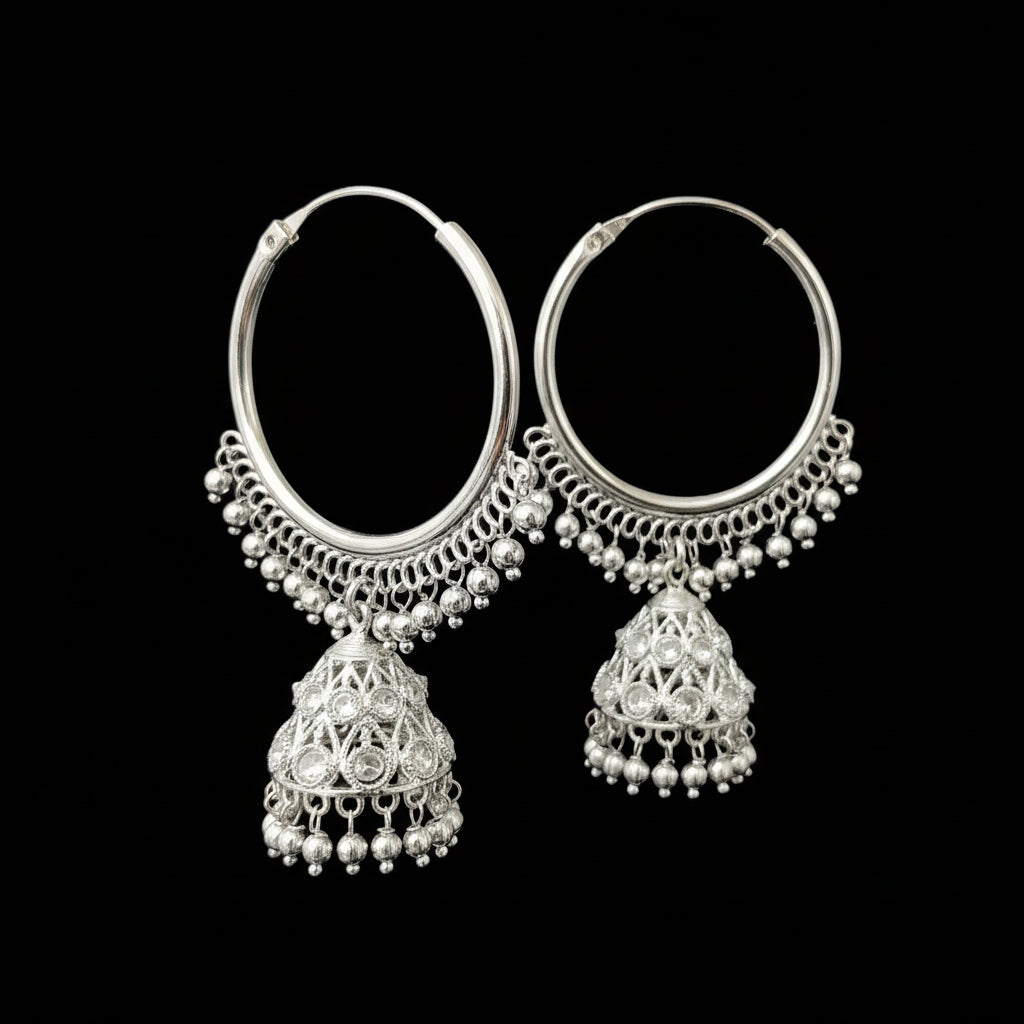 Silver hoop earrings with dangling elements on a gray background, featuring the brand 'SAHELI'.
