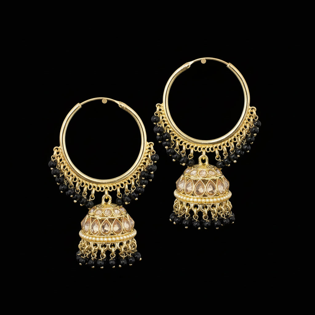 Gold and black beaded earrings on black stands with 'SAHeli' branding.