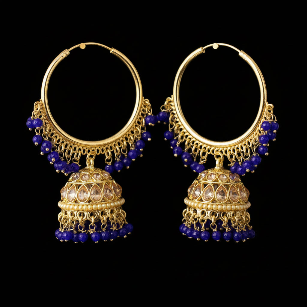 Gold hoop earrings with blue beads on a gray background, featuring the brand 'Saheli'.