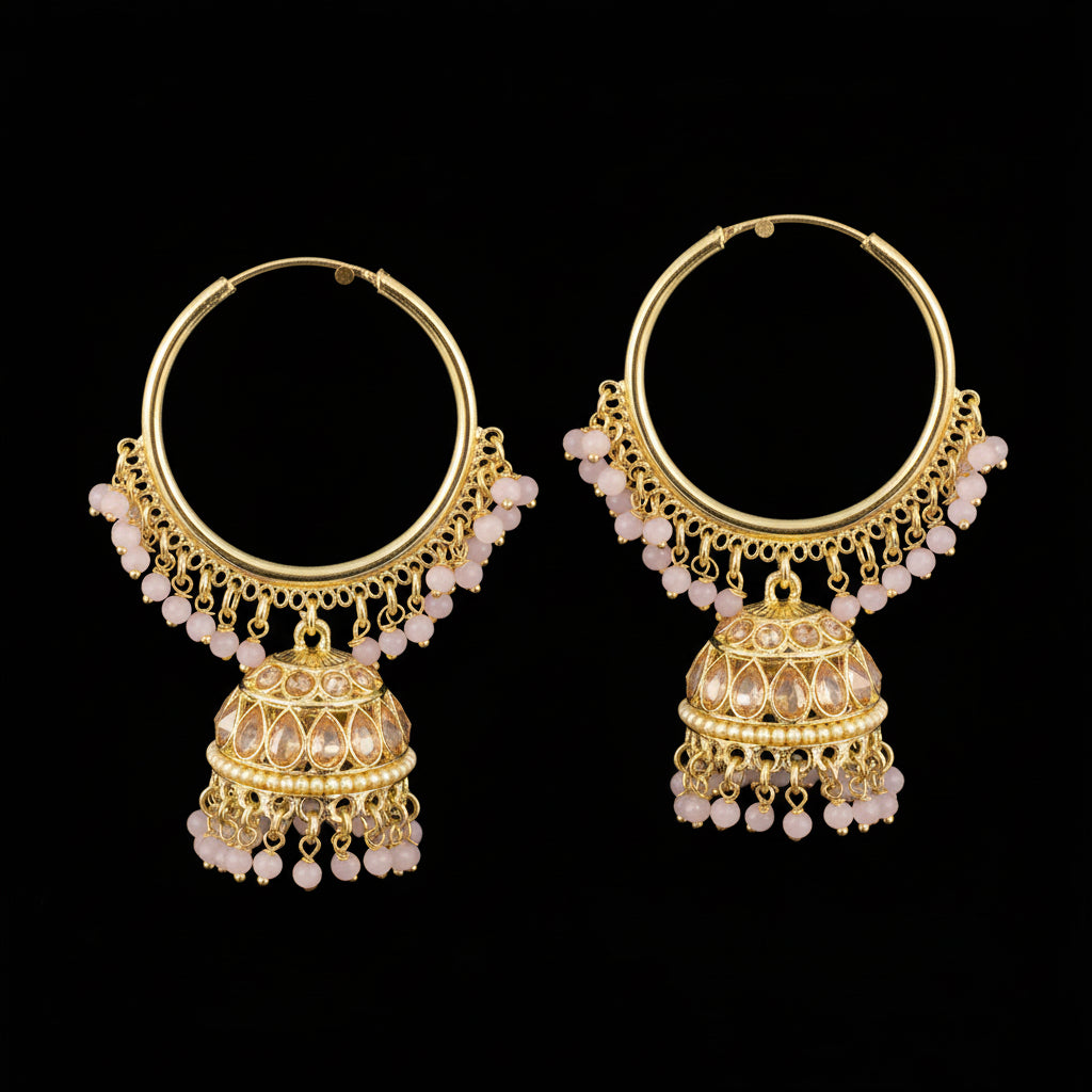 Gold hoop earrings with pink beads on a gray background, featuring the brand 'Saheli'.