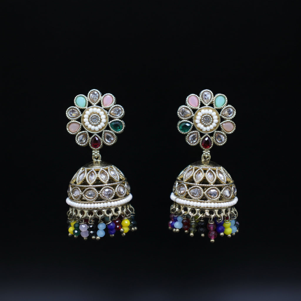 Pair of colorful jhumka earrings on a black background