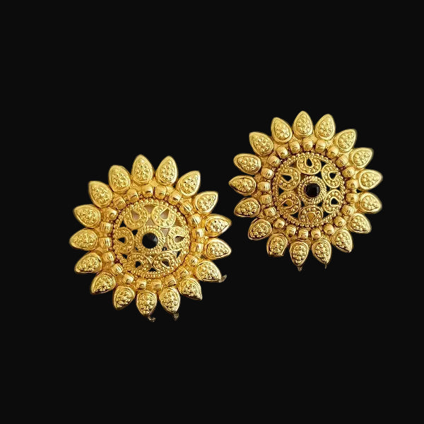 Gold floral earrings on a black background with 'Saheli' branding.