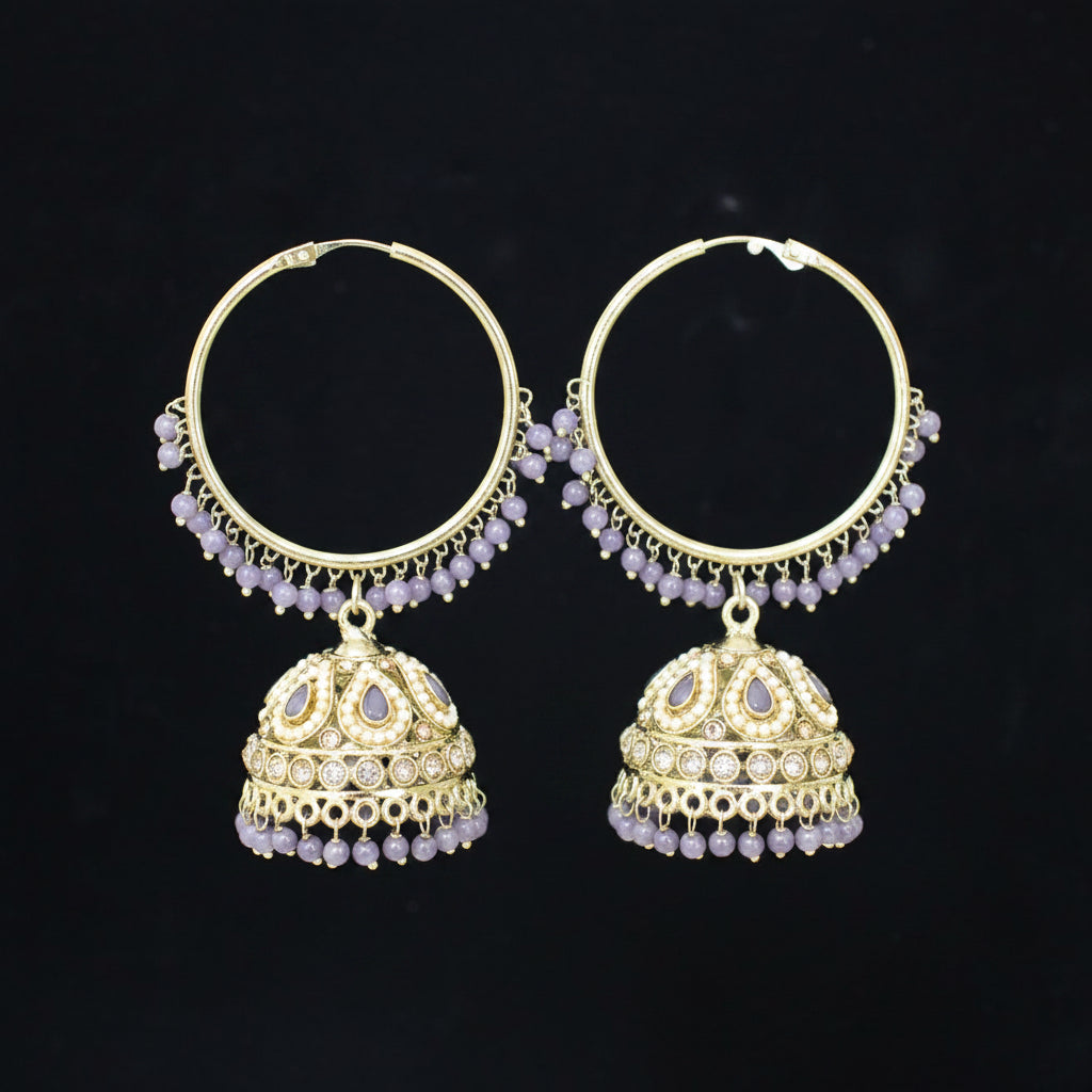 Gold hoop earrings with jhumka designs on a black background