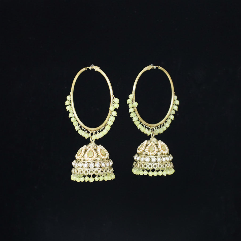 Gold hoop earrings with dangling elements on a black background