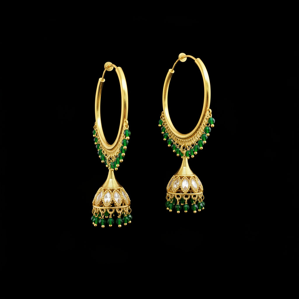 A pair of gold-plated Indian jhumka hoop earrings with green bead fringe and dangling bell-shaped charms, displayed on a gray jewelry stand.