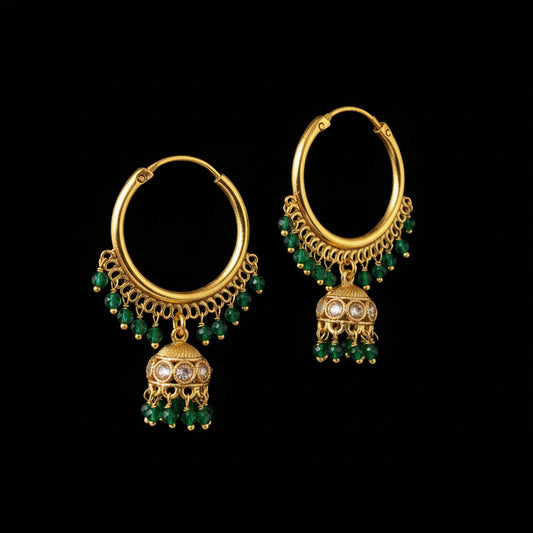 Gold hoop earrings with green gemstones on a gray background, featuring the brand 'Saheli'.