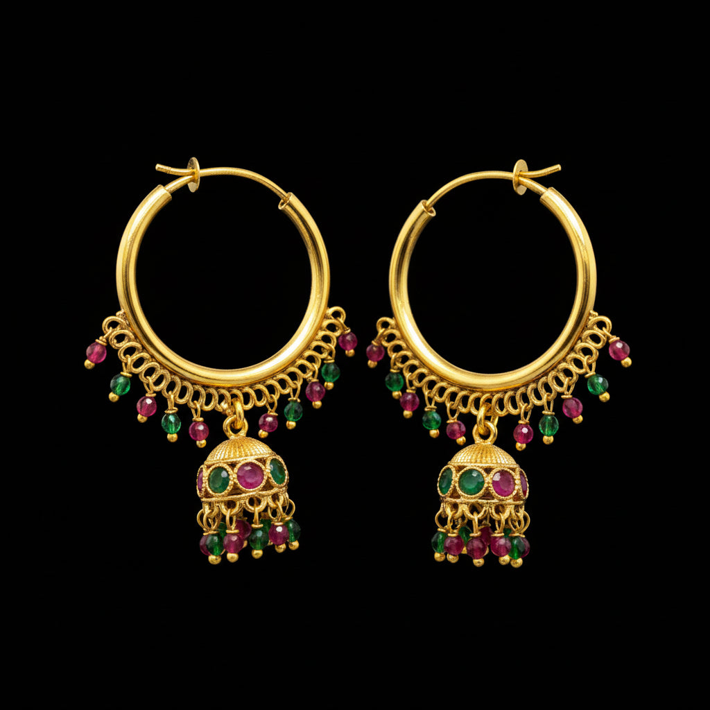 Gold hoop earrings with gemstones on a gray background, featuring the brand 'SAHELI'.