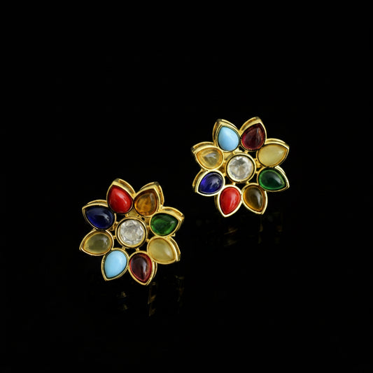 Pair of colorful flower-shaped earrings on a gray background