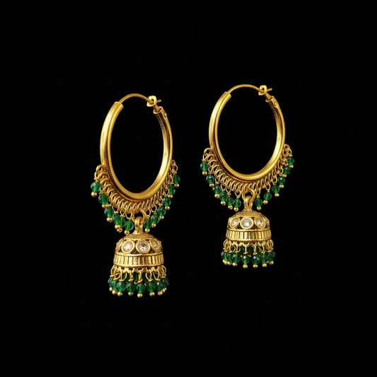 Gold hoop earrings with green beads on a gray background, featuring the brand 'SAHELI'.