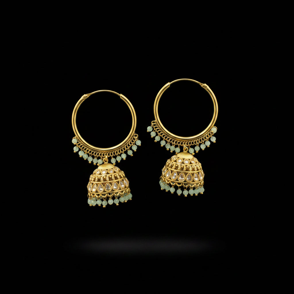 Gold hoop earrings with jhumka designs on a black background