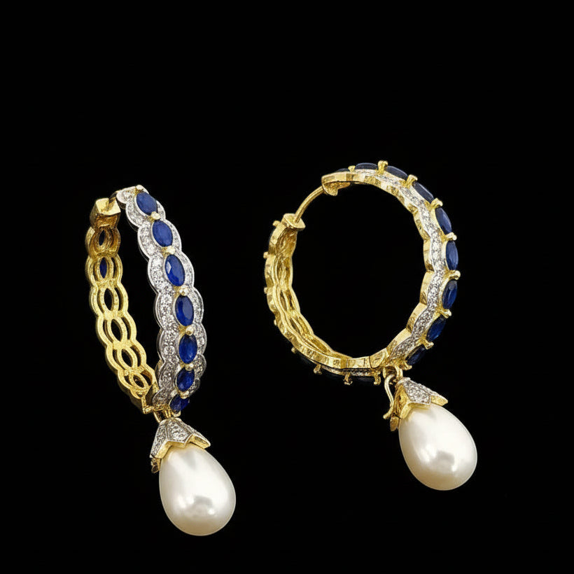 Jewelry set with earrings and ring on a dark background, featuring the brand 'Saheli'.