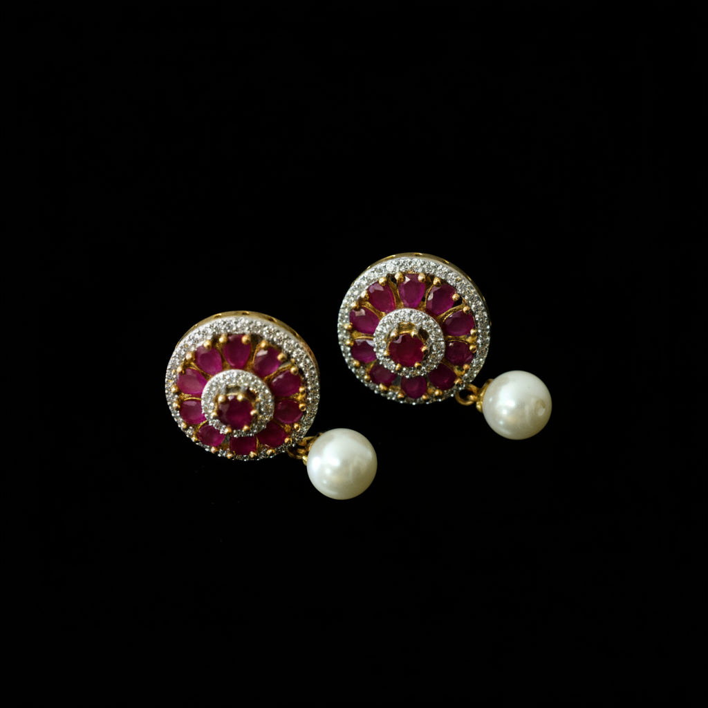 Jewelry set with circular designs and pearl-like elements on a dark background, featuring the brand 'Saheli'.