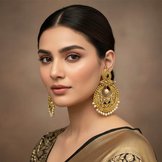 Gold and pearl earrings on a dark background with 'SAHELI' branding.
