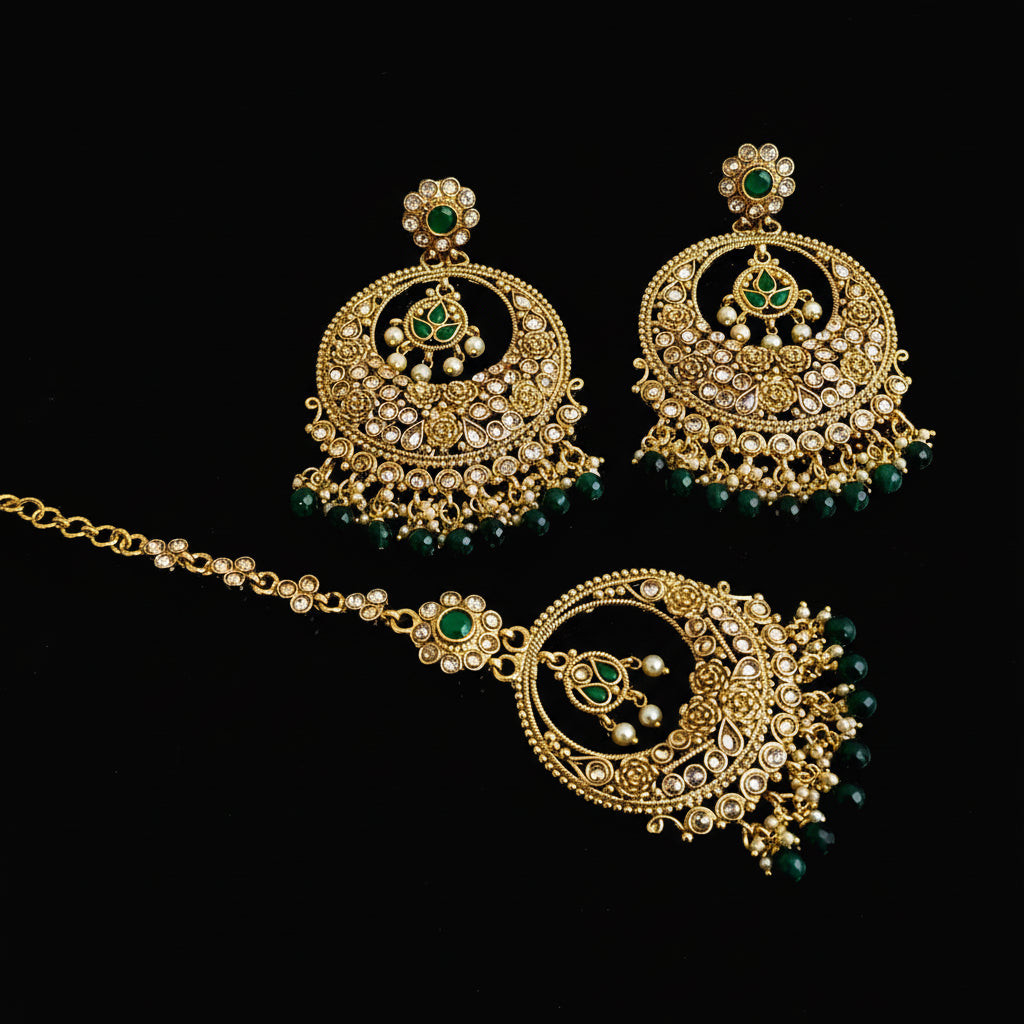 Gold necklace and earrings with green beads on a dark background, featuring the brand 'Saheli'.