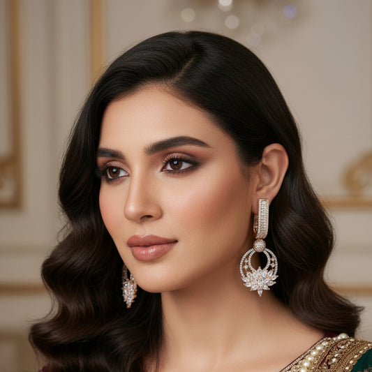 Pair of diamond earrings on a dark background