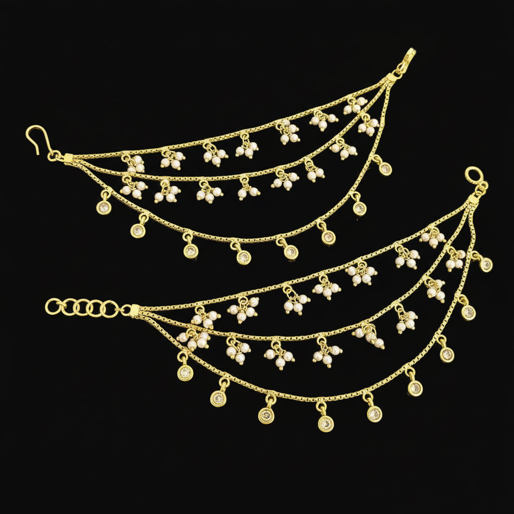 Gold necklace with floral pendants on a gray background, featuring the brand 'SAHELI'.
