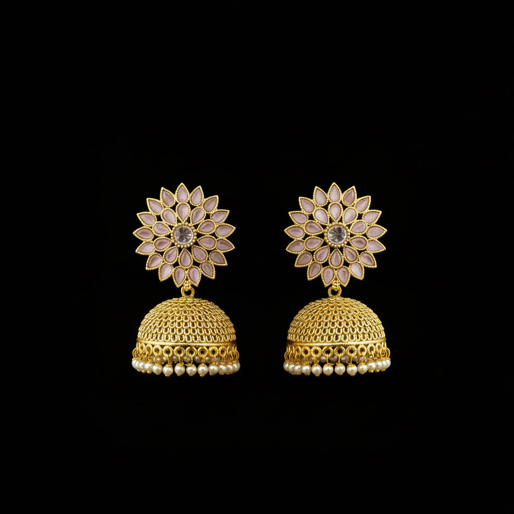 Gold jhumka earrings on a gray stand with HP logo in the background
