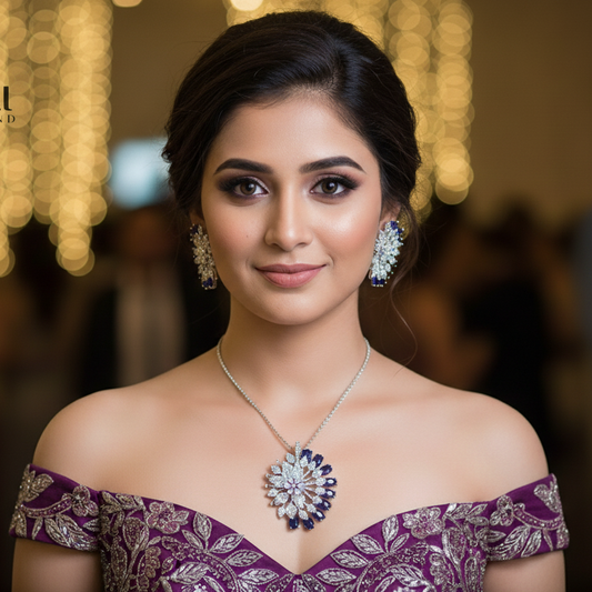 Woman wearing a purple off-shoulder top with jewelry, blurred background