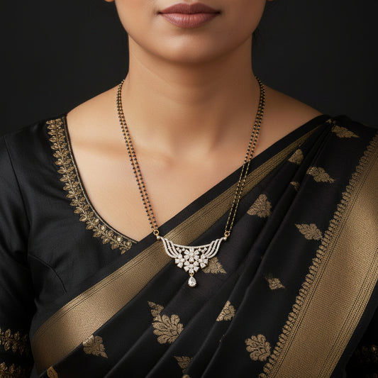 Gold and white stone necklace with a curved, fan-shaped pendant featuring a teardrop drop, displayed on a black background with the Sahell My Best Friend logo in the top right.