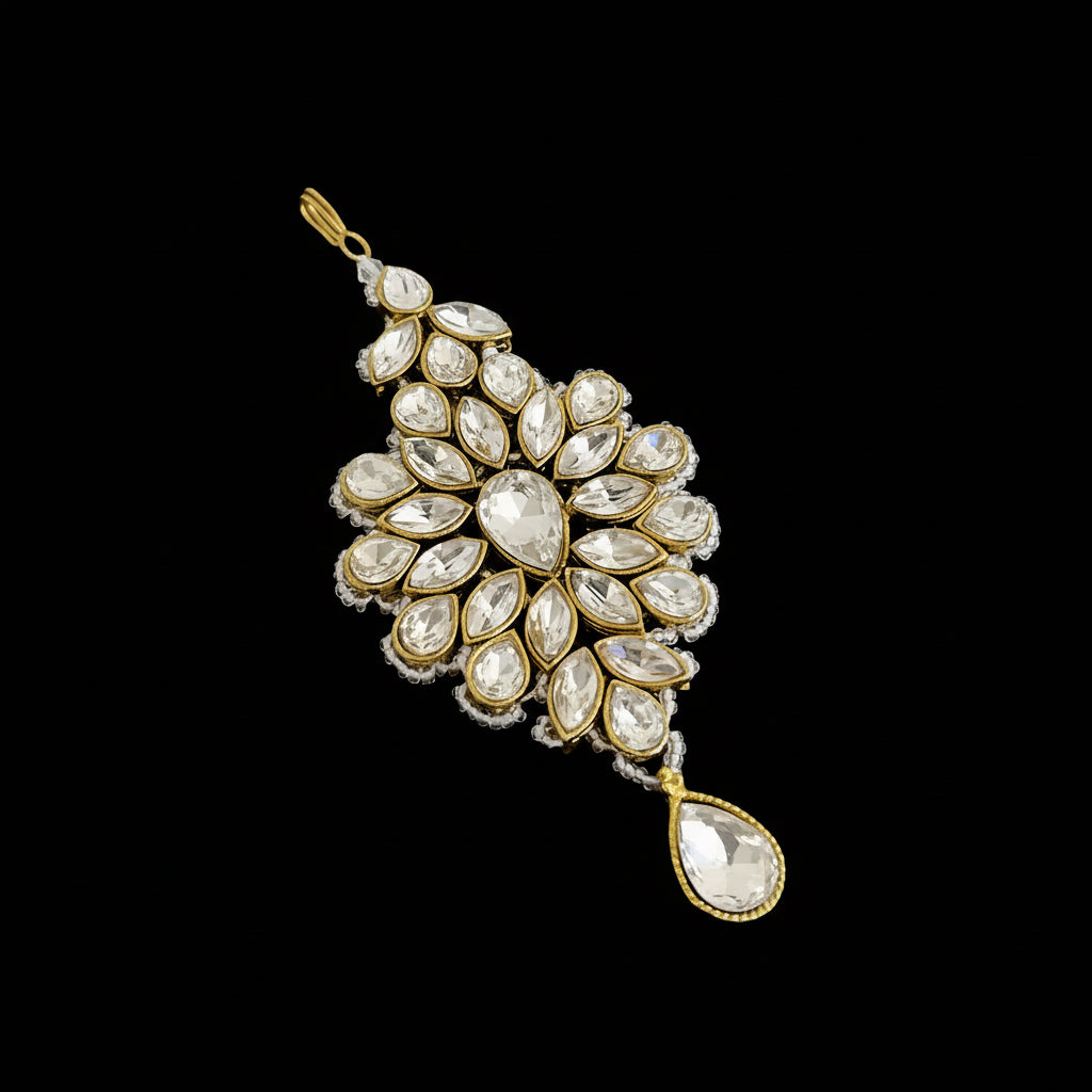 Jewelry pendant with gemstones on a dark background, branded 'SAHELI'.