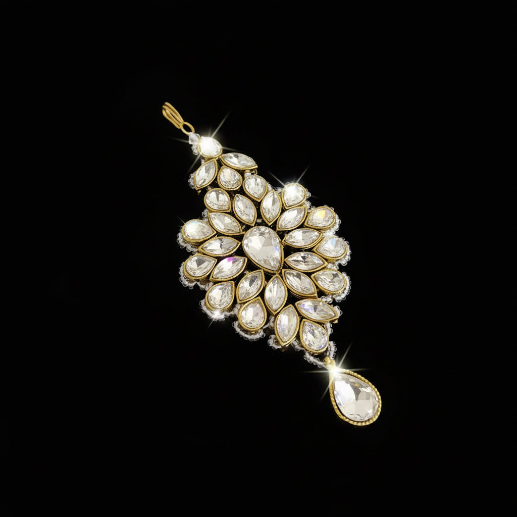 Jewelry pendant with gemstones on a dark background, branded 'SAHELI'.