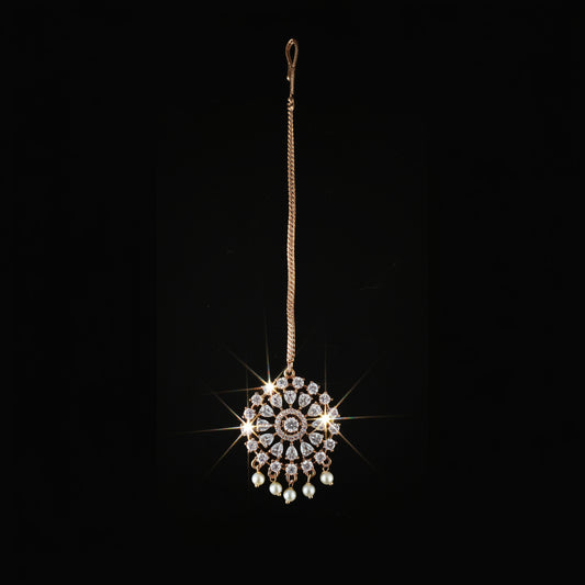 Jewelry pendant with intricate design on a dark background
