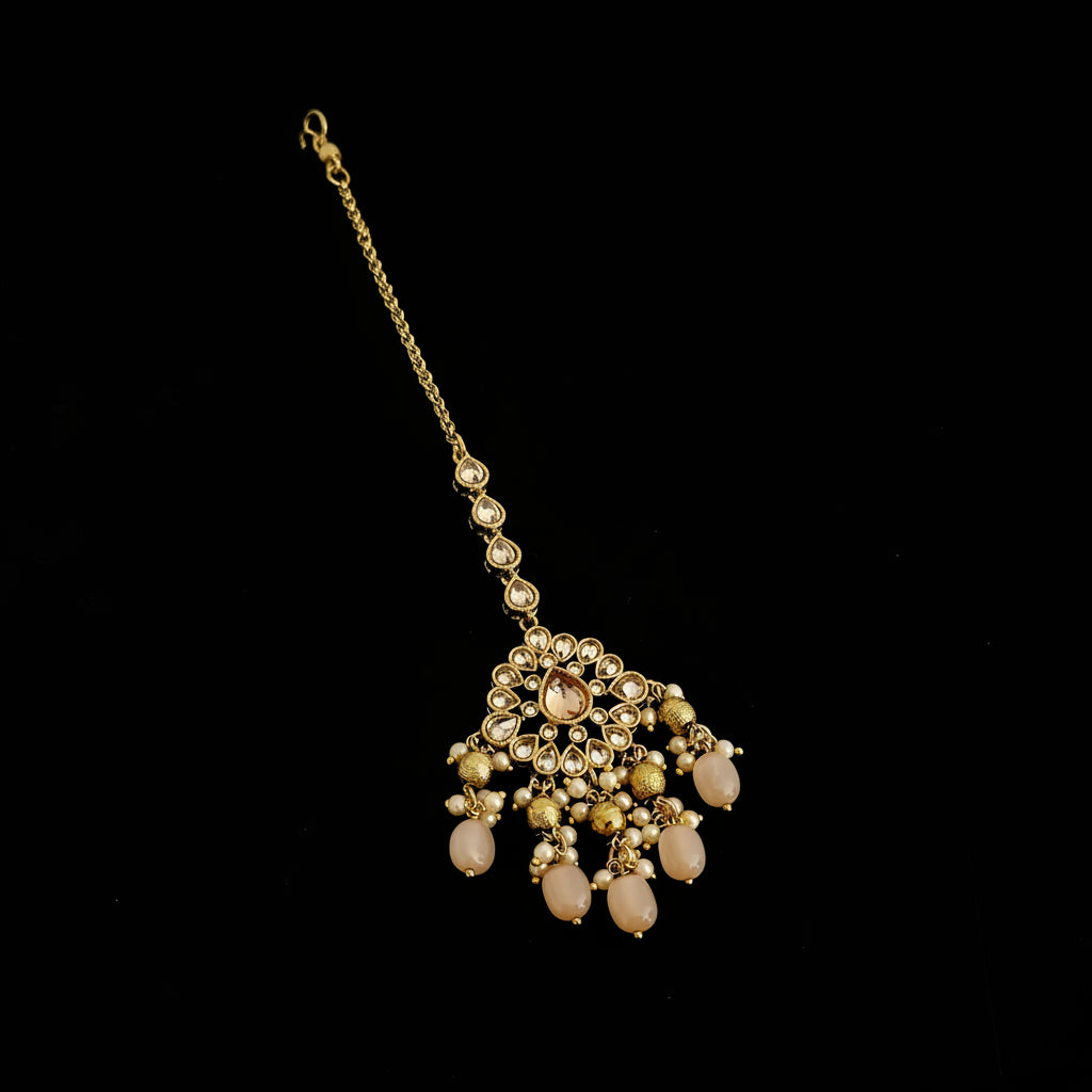 Gold necklace with pendant on a black background