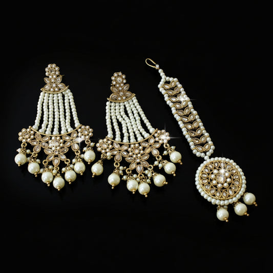 Ornate gold and pearl jewelry set on a dark background with 'Saheli' branding.