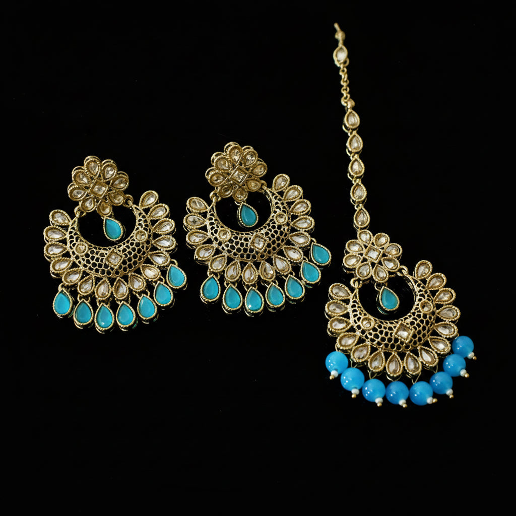 Jewelry set with gold and blue elements on a dark background, featuring the brand 'Saheli'.