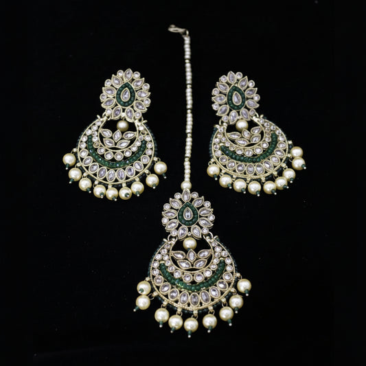 Jewelry set with earrings and a necklace on a black background