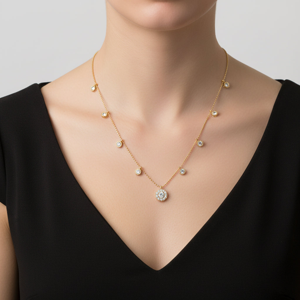 Gold necklace with diamond pendants on a black background