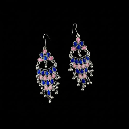 Decorative earrings with blue and pink stones on a gray background, branded 'SAHELI'.