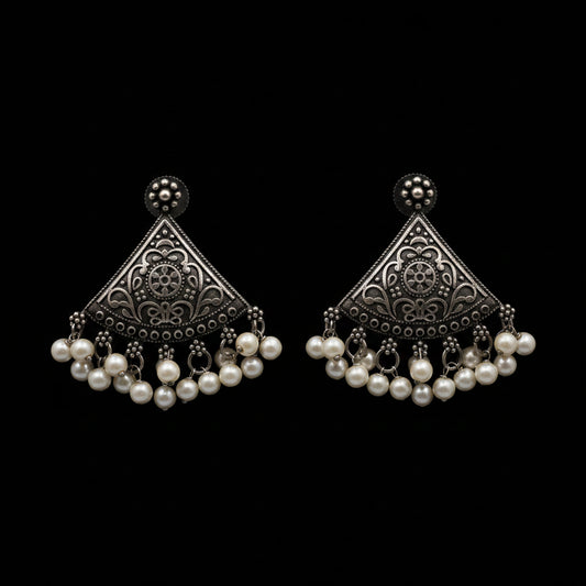 A pair of traditional Indian silver-toned filigree dangle earrings with white pearl bead drops, displayed on a light gray background with the brand logo 'SAHELL MY BEST FRIEND' above them.