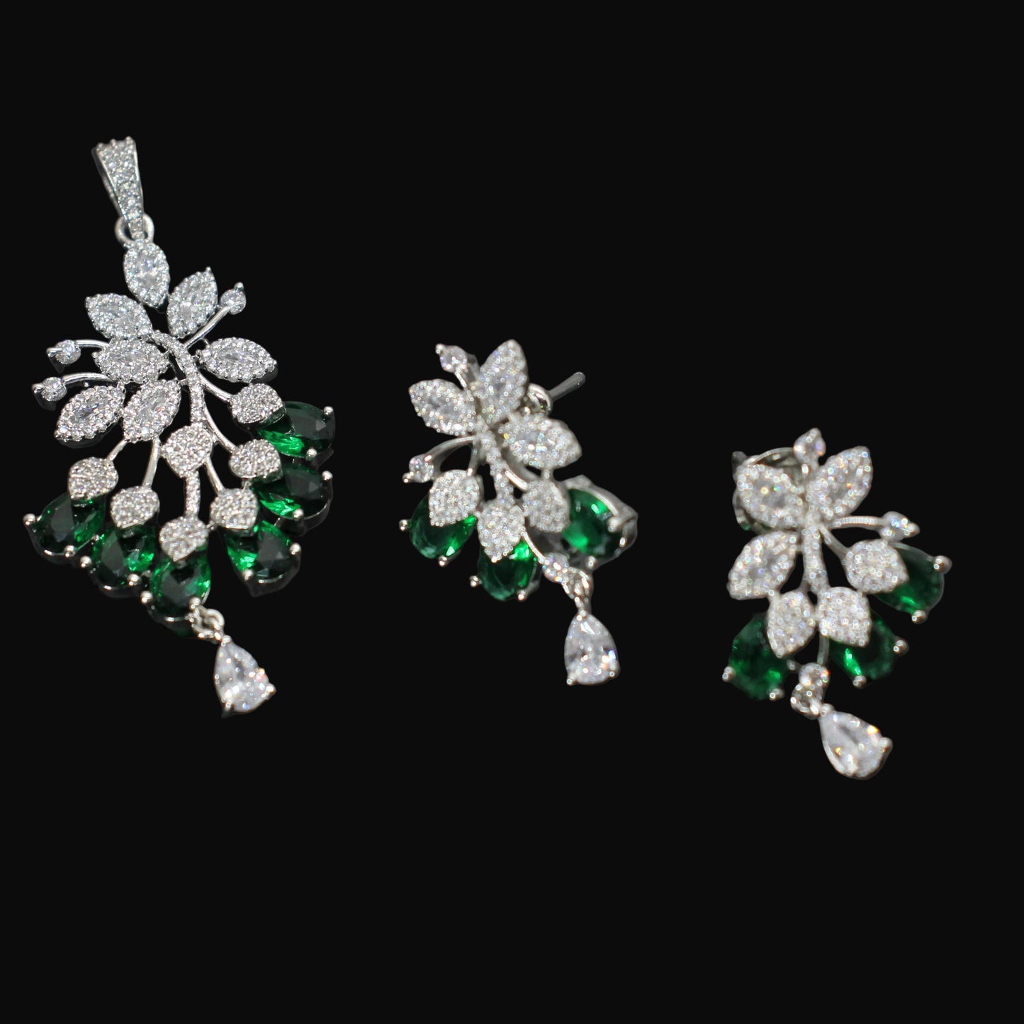 Jewelry set with pendant and earrings on a dark background
