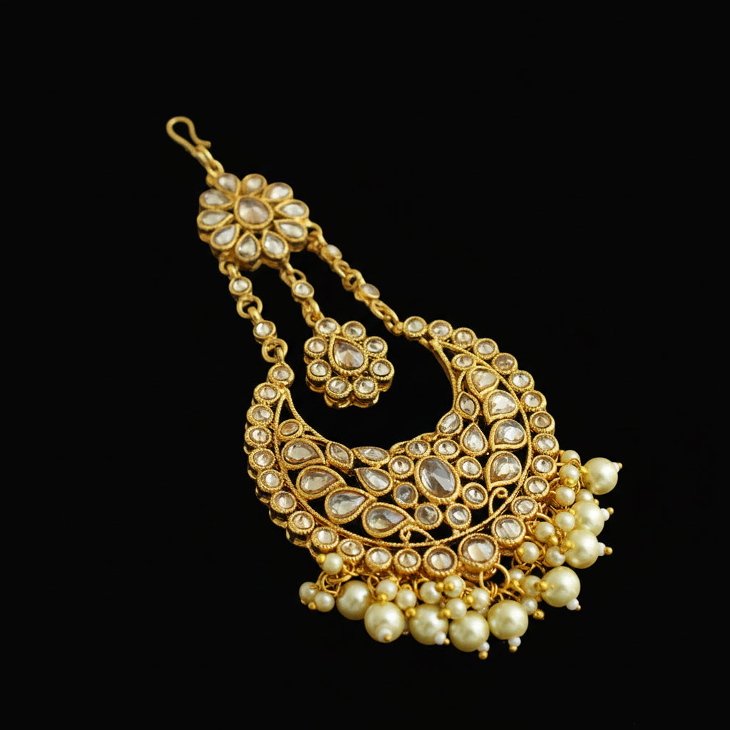 Gold and pearl necklace on a black background