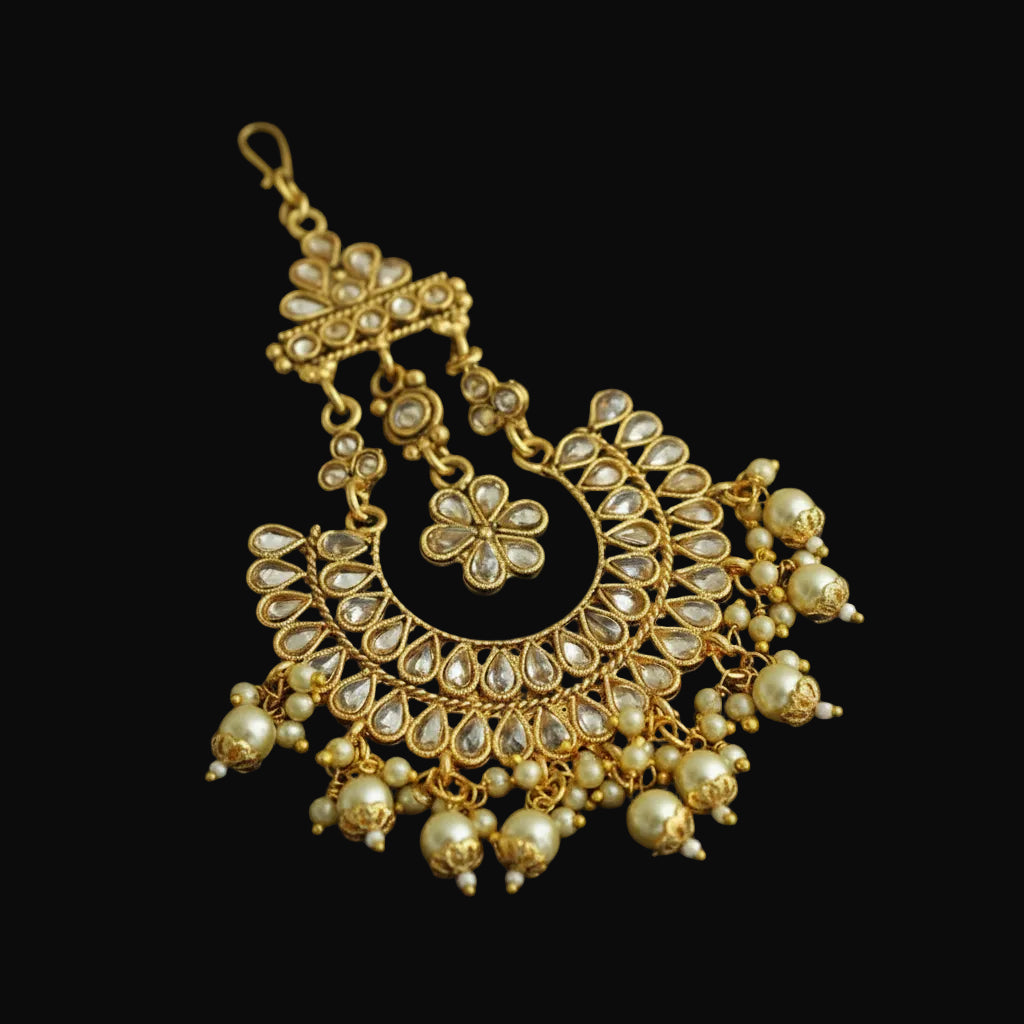 Gold and pearl decorative pendant on a black background