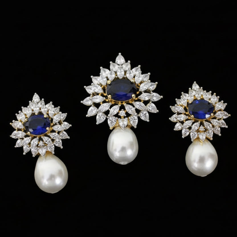 Set of diamond and pearl earrings on a dark background