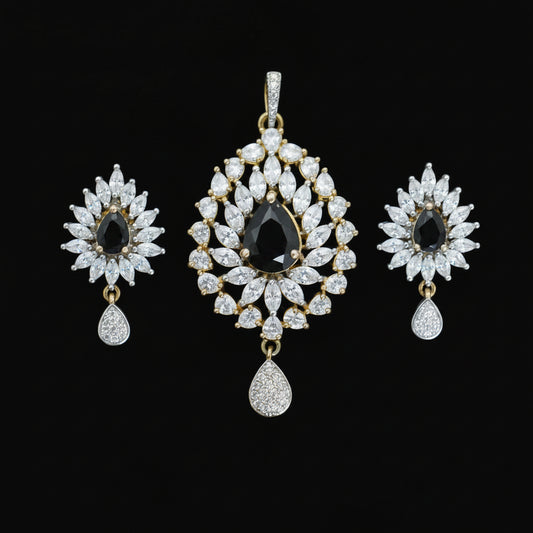 Jewelry set with teardrop-shaped diamonds on a dark background, featuring the brand 'Saheli'.