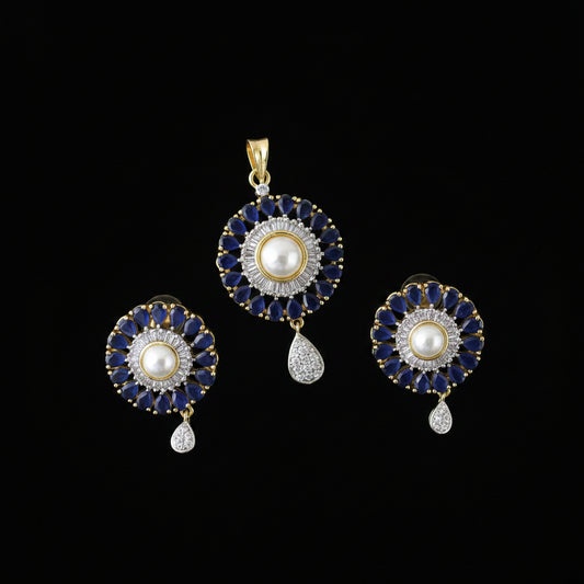 Jewelry set with pendant and earrings on a black background, featuring the brand 'Saheli'.