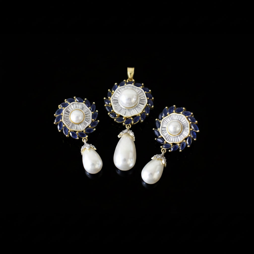 Jewelry set with pearls and gold accents on a dark background, featuring the brand 'SAHELL'.