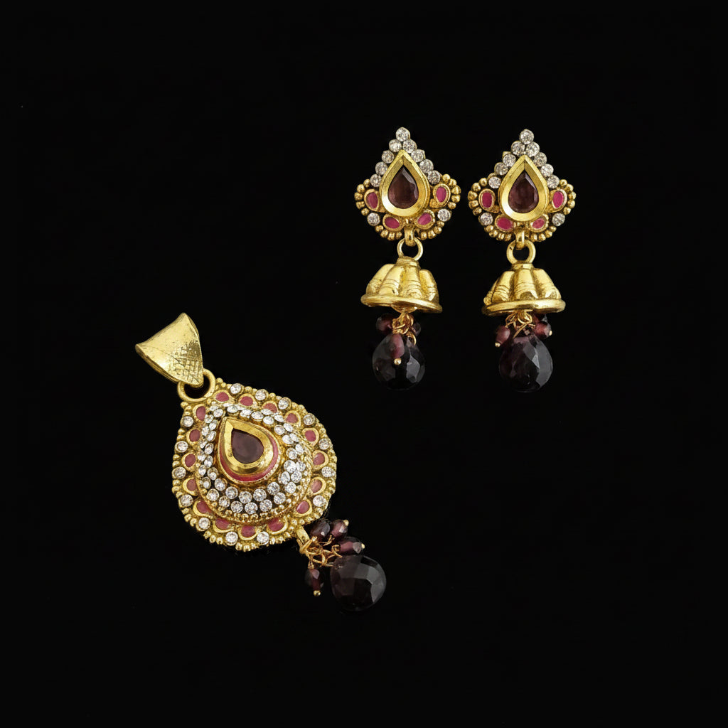 Gold jewelry set with pendant and earrings on a dark background, featuring the brand 'SAHELI'.