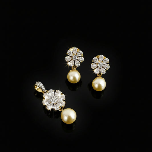 Gold earrings with floral designs on a dark background, featuring the brand 'SAHELI'.