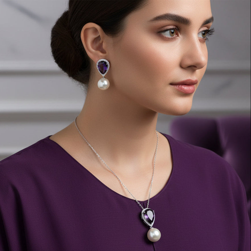 Jewelry set with necklace and earrings on a black background, featuring the brand 'Saheli'.