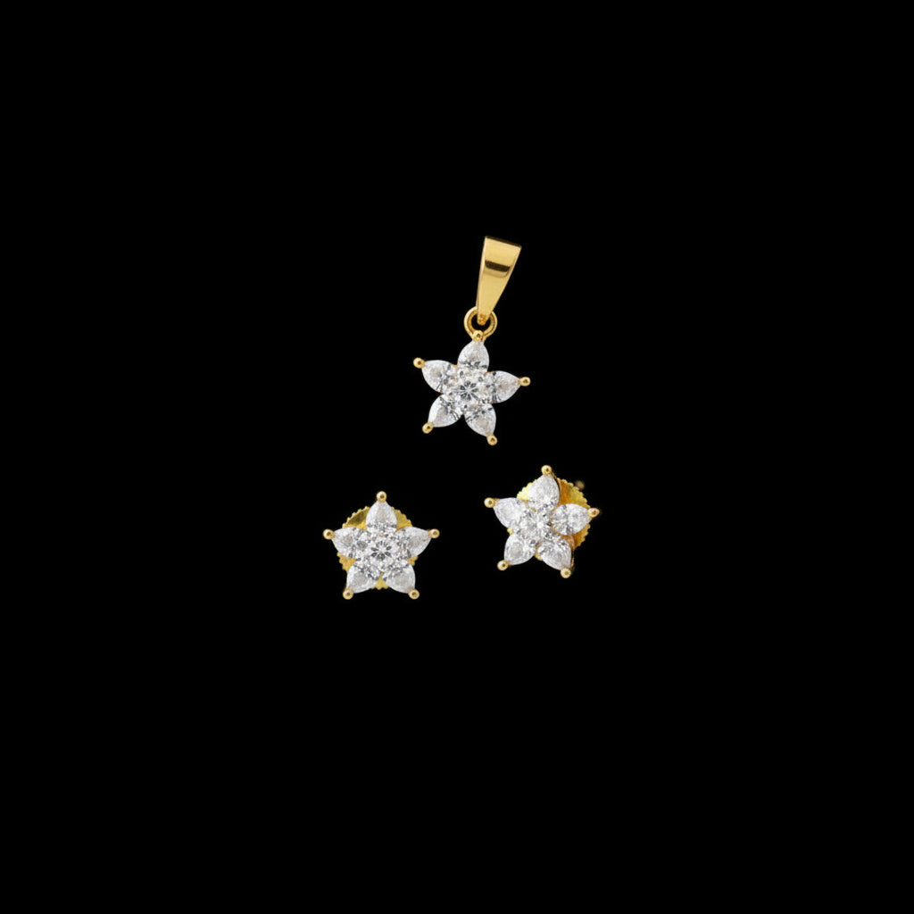 Gold and diamond jewelry set on a gray surface with 'SAHELI' branding.