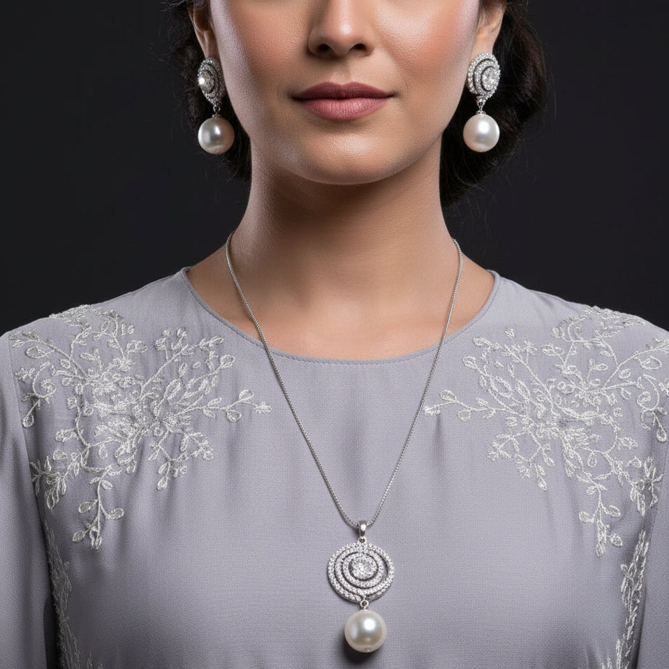 Jewelry set with necklace and earrings on a black background, featuring the brand 'Saheli'.