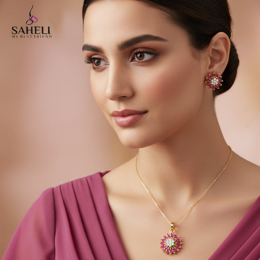 Gold jewelry set with pink gemstones on a gray background, featuring the brand 'SAHELL'.