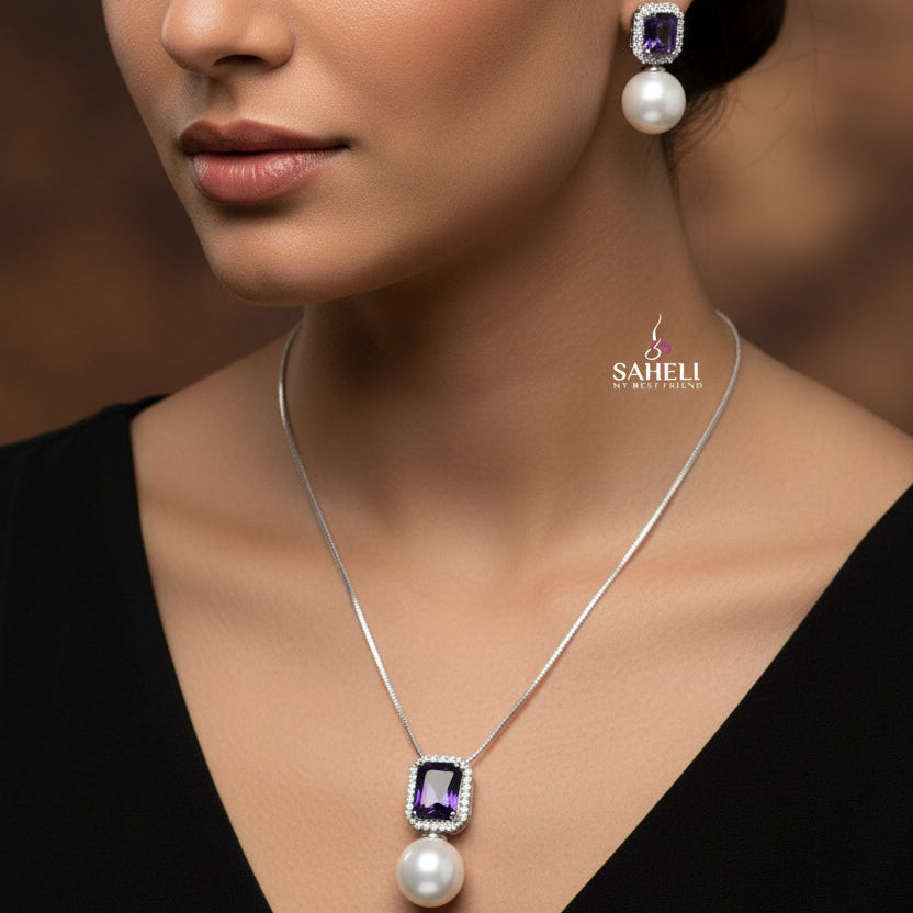 Jewelry set with necklace and earrings on a black background, featuring the brand 'Saheli'.