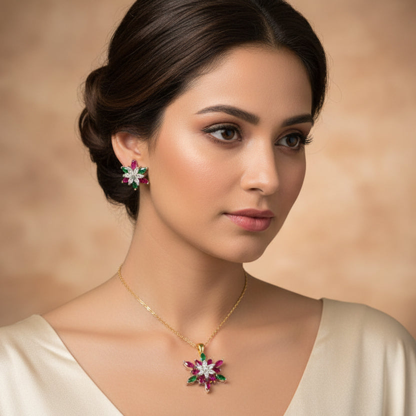 Floral earrings with pink, green, and white stones on a dark background, branded 'SAHELI'.
