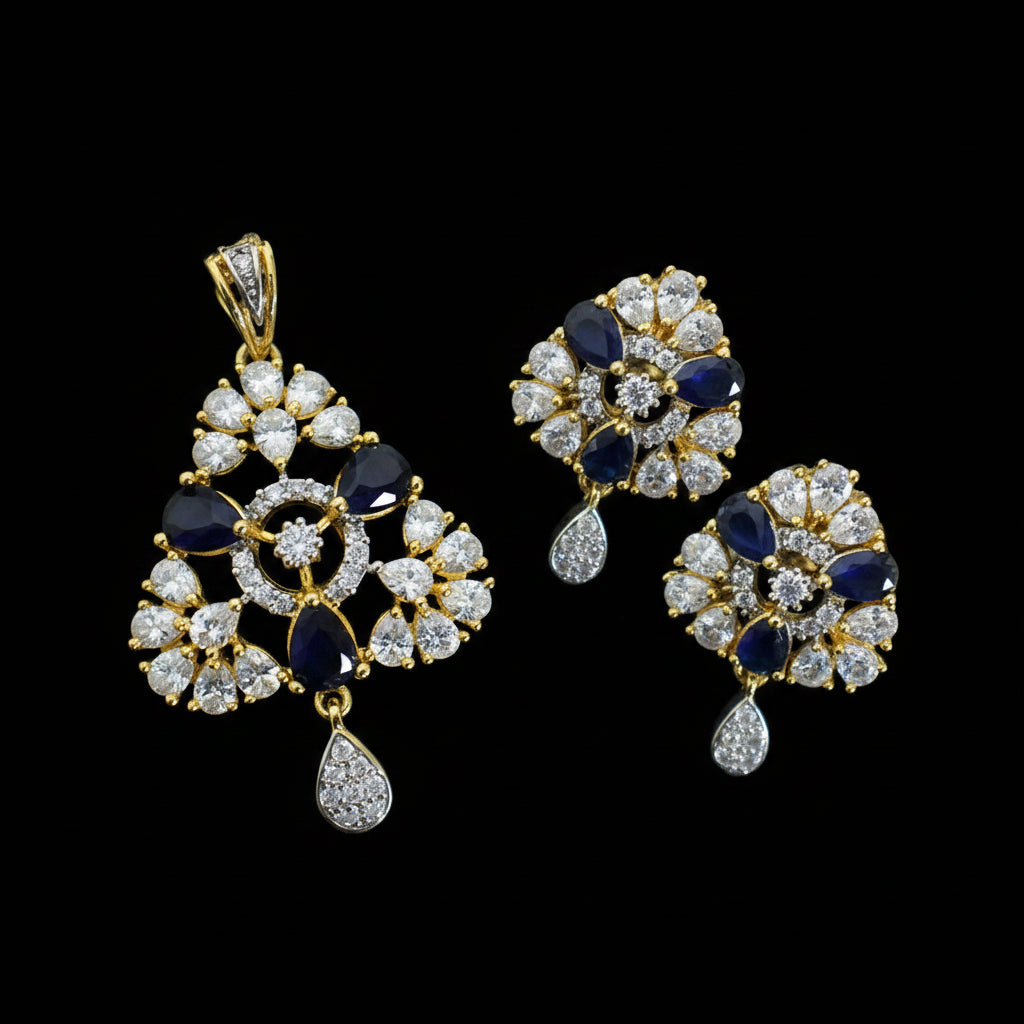 Jewelry set with pendant and earrings on a dark background, featuring the brand 'Saheli'.